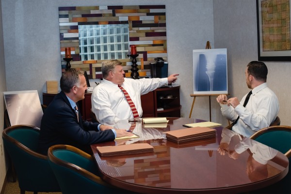 Photo of the firm's attorneys in a conference room